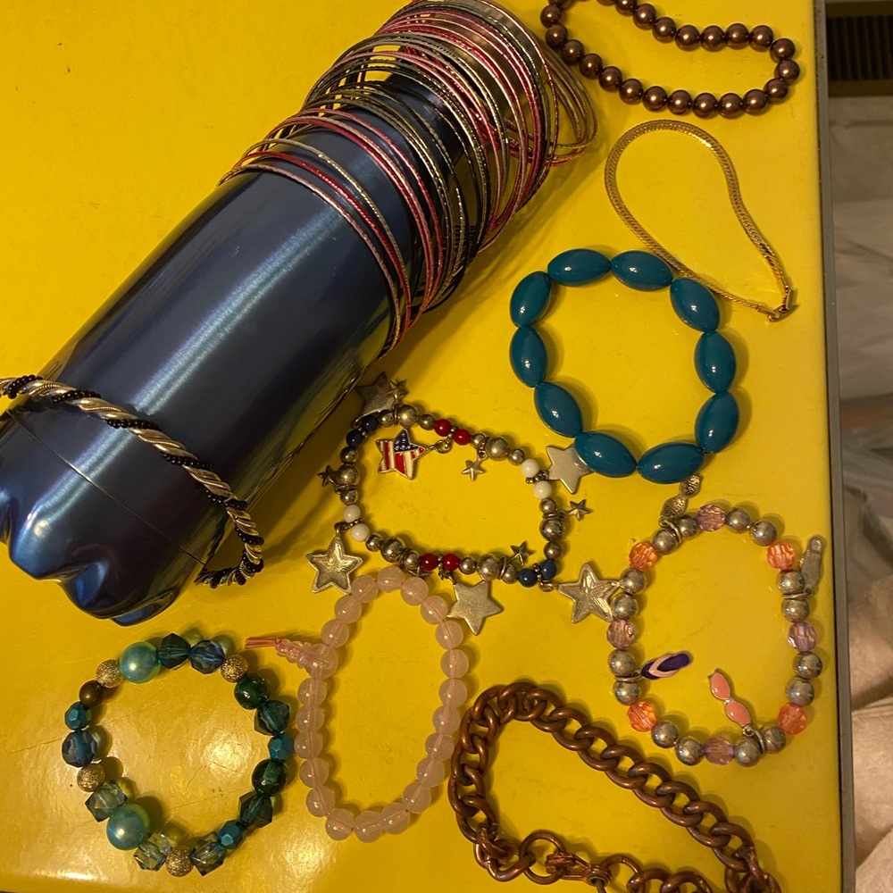 Ten bracelets including thin bangle set.